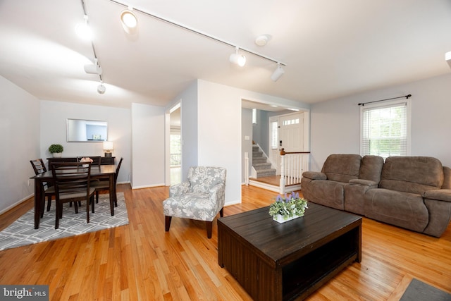 106 Everest Cir Unit 106, West Chester, PA 19382 - living room featuring track lighting, light wood finished floors, and stairway