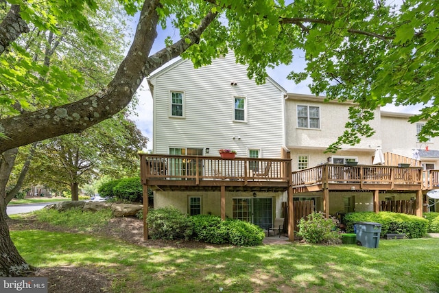 106 Everest Cir Unit 106, West Chester, PA 19382 - back of property with a wooden deck, stucco siding, and a yard