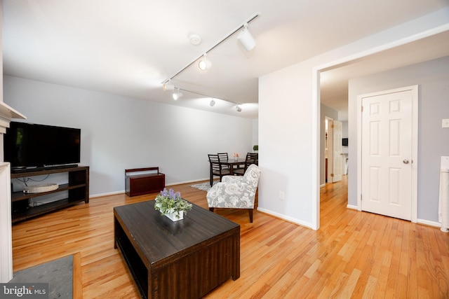 106 Everest Cir Unit 106, West Chester, PA 19382 - living room with track lighting, light wood finished floors, and baseboards