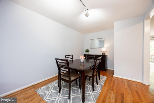 106 Everest Cir Unit 106, West Chester, PA 19382 - dining space with wood finished floors, rail lighting, and baseboards