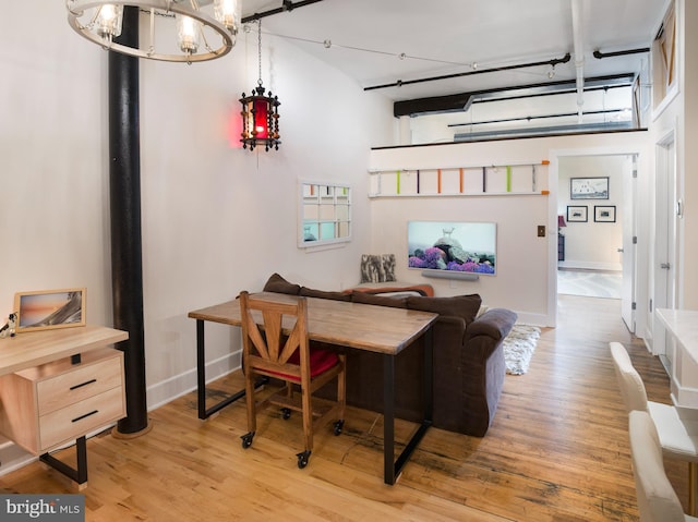 200 Lincoln Ave Unit 213, Phoenixville, PA 19460 - living room featuring a chandelier, light wood-style floors, and baseboards