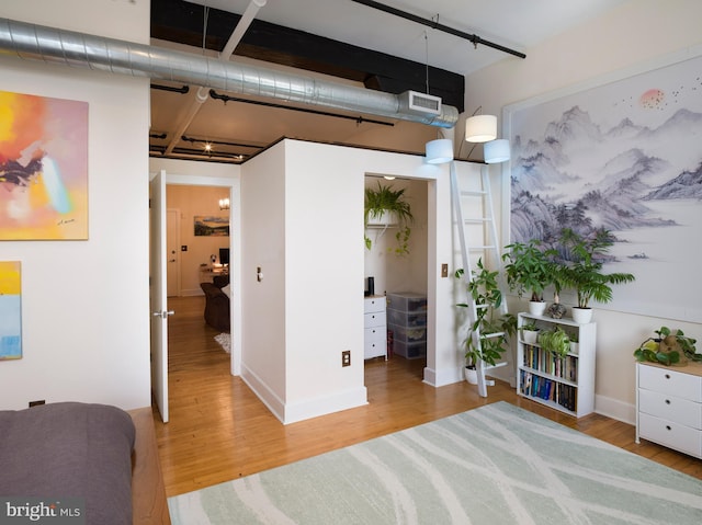 200 Lincoln Ave Unit 213, Phoenixville, PA 19460 - bedroom with wood finished floors, track lighting, and baseboards