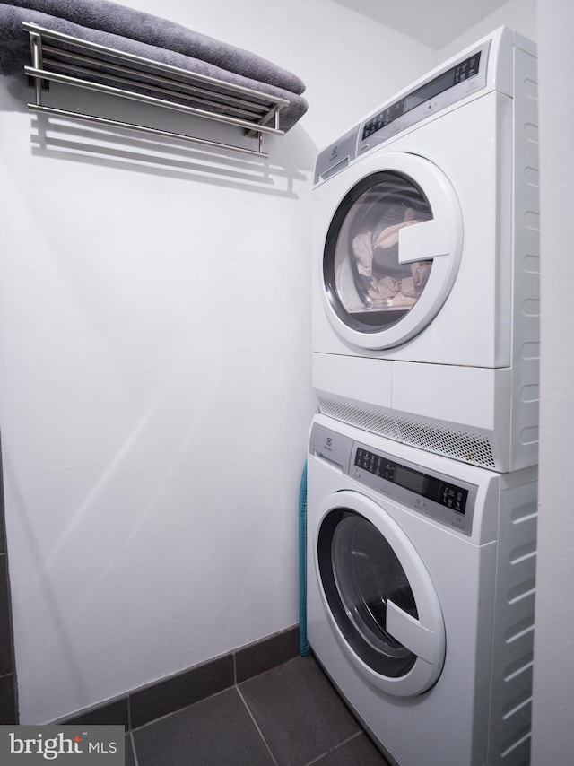 200 Lincoln Ave Unit 213, Phoenixville, PA 19460 - washroom with estacked washer and dryer and tile patterned flooring