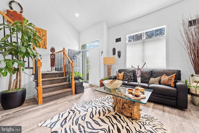 68 Winthrop Rd, Monroe Township, NJ 08831 - living area featuring high vaulted ceiling, stairs, wood finished floors, and recessed lighting