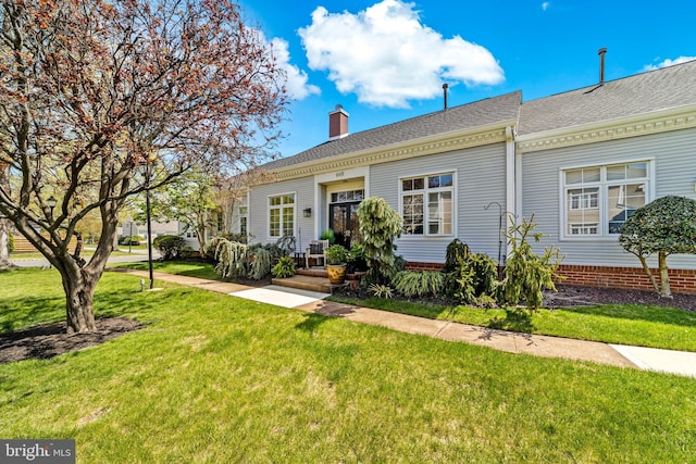 68 Winthrop Rd, Monroe Township, NJ 08831 - view of front of home with a front yard, a chimney, and roof with shingles