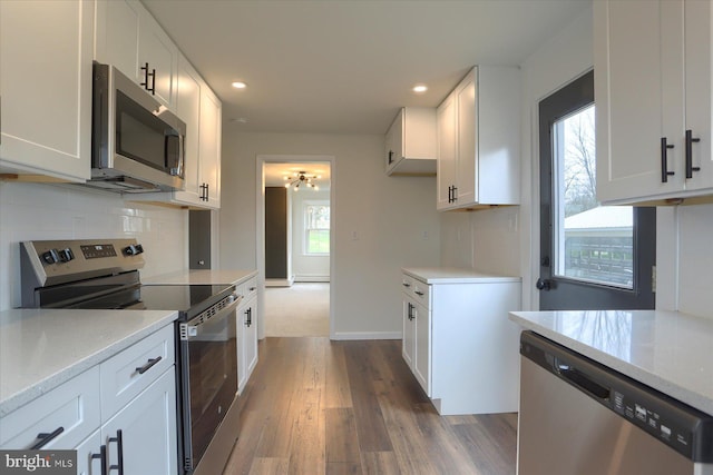 323 Plaza Dr, Palmyra, PA 17078 - kitchen featuring stainless steel appliances, dark wood-style flooring, white cabinets, recessed lighting, and ceiling fan