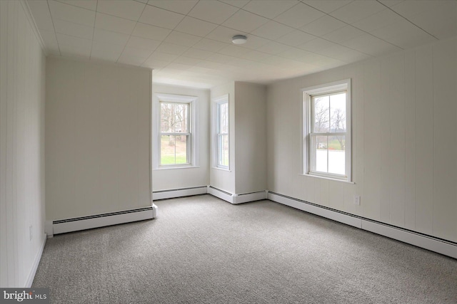 323 Plaza Dr, Palmyra, PA 17078 - unfurnished room featuring a baseboard heating unit, healthy amount of natural light, and carpet