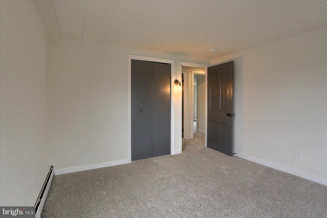 323 Plaza Dr, Palmyra, PA 17078 - unfurnished bedroom with a baseboard heating unit, carpet, and baseboards
