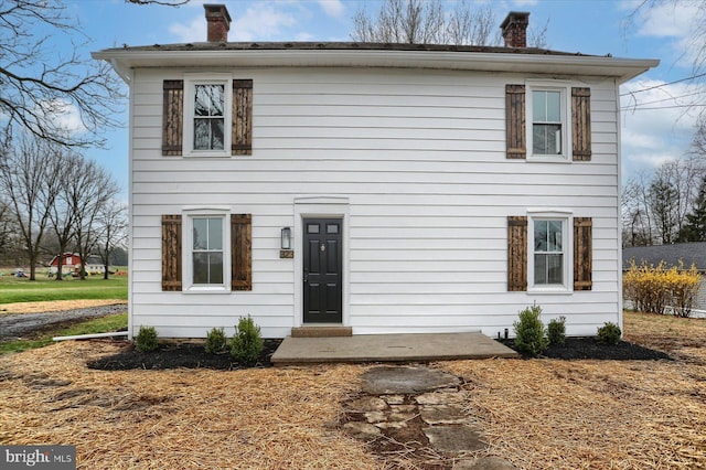 323 Plaza Dr, Palmyra, PA 17078 - view of front facade featuring a chimney