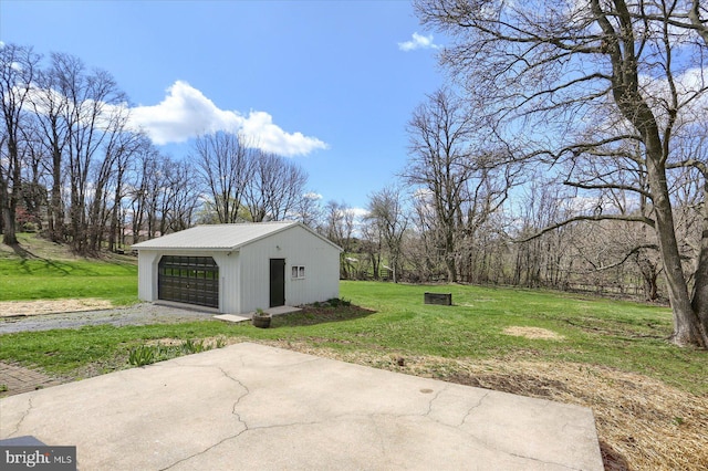 323 Plaza Dr, Palmyra, PA 17078 - view of grassy yard with an outbuilding and a detached garage