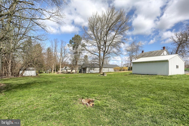 323 Plaza Dr, Palmyra, PA 17078 - view of grassy yard with an outdoor structure