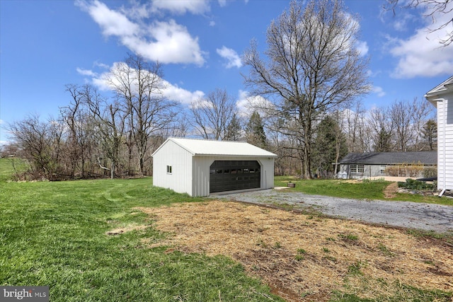 323 Plaza Dr, Palmyra, PA 17078 - view of green lawn with an outbuilding and a garage