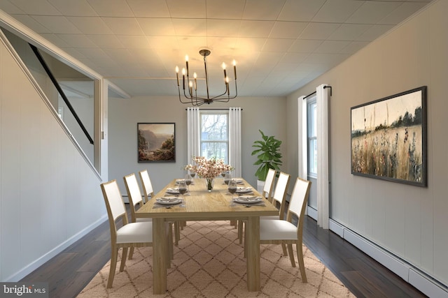 323 Plaza Dr, Palmyra, PA 17078 - dining area featuring baseboard heating, dark wood-type flooring, a chandelier, and baseboards