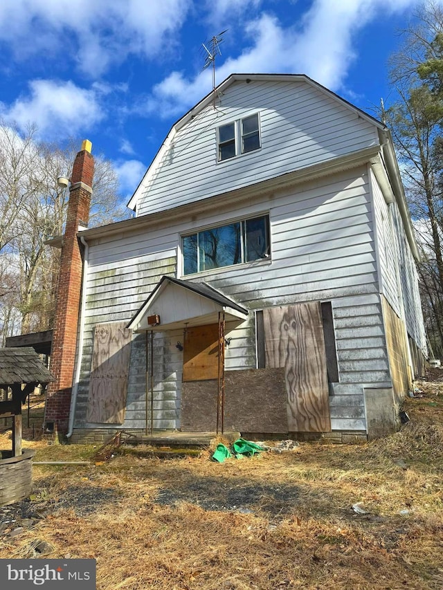 431 2nd St, Harveys Lake, PA 18618 - rear view of house featuring a chimney