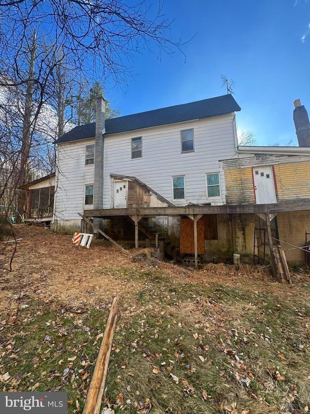 431 2nd St, Harveys Lake, PA 18618 - rear view of property with a chimney and stairway
