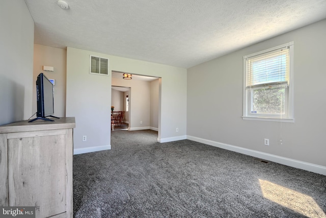 5221 Trumps Mill Rd, Baltimore, MD 21206 - unfurnished living room featuring carpet flooring and a textured ceiling