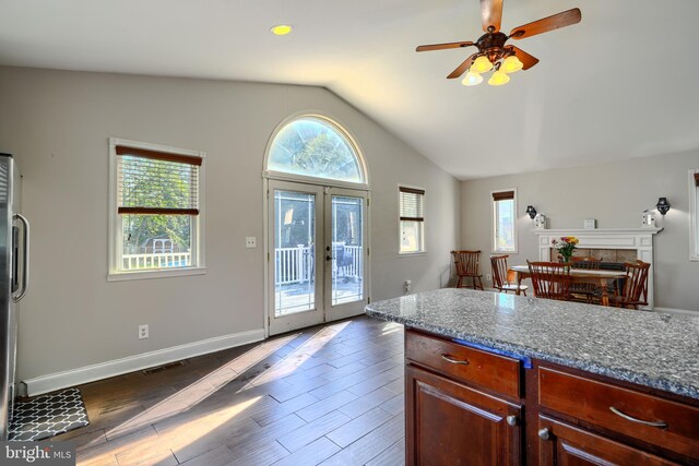 5221 Trumps Mill Rd, Baltimore, MD 21206 - kitchen with french doors, a ceiling fan, lofted ceiling, dark wood finished floors, and dark stone countertops