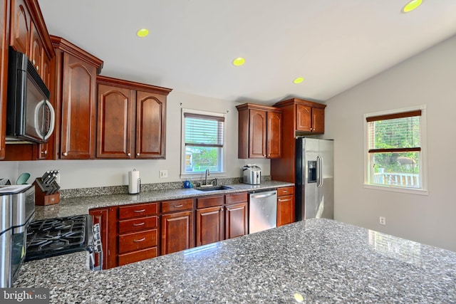5221 Trumps Mill Rd, Baltimore, MD 21206 - kitchen featuring appliances with stainless steel finishes, lofted ceiling, recessed lighting, and dark stone counters