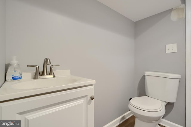5221 Trumps Mill Rd, Baltimore, MD 21206 - half bath featuring vanity and wood finished floors