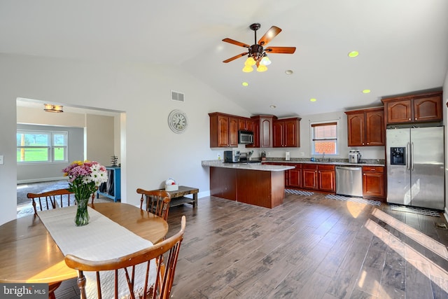5221 Trumps Mill Rd, Baltimore, MD 21206 - kitchen featuring stainless steel appliances, lofted ceiling, light countertops, a ceiling fan, and dark wood-style flooring