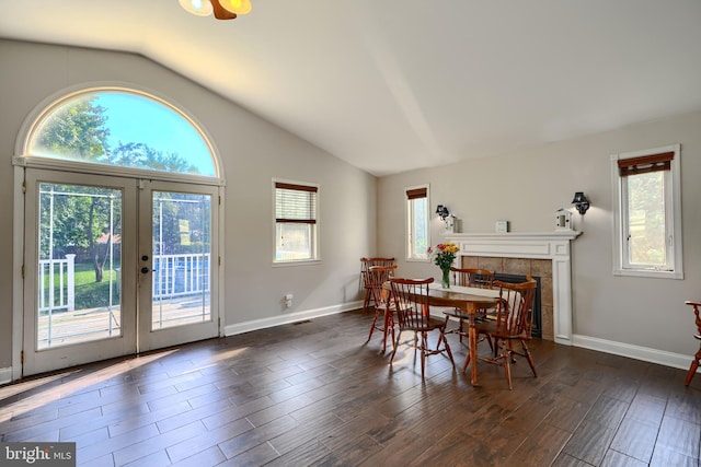 5221 Trumps Mill Rd, Baltimore, MD 21206 - dining room with lofted ceiling, french doors, a tiled fireplace, and dark wood finished floors