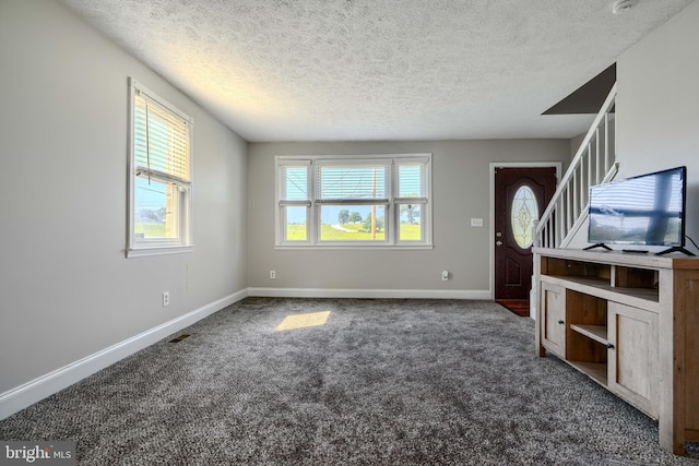 5221 Trumps Mill Rd, Baltimore, MD 21206 - unfurnished living room with a textured ceiling and carpet