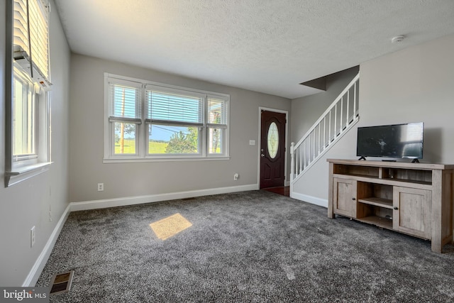 5221 Trumps Mill Rd, Baltimore, MD 21206 - carpeted entrance foyer with a textured ceiling and stairway