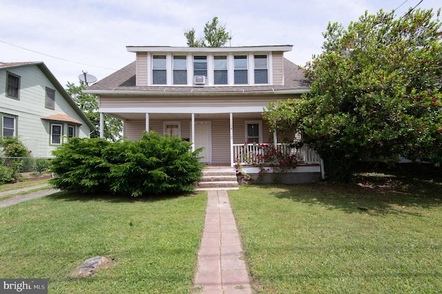 113 Washington St, Cambridge, MD 21613 - view of front of house featuring a porch, a front lawn, and a shingled roof