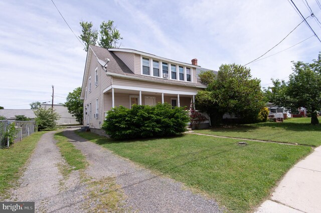 113 Washington St, Cambridge, MD 21613 - view of front of house with driveway and a chimney
