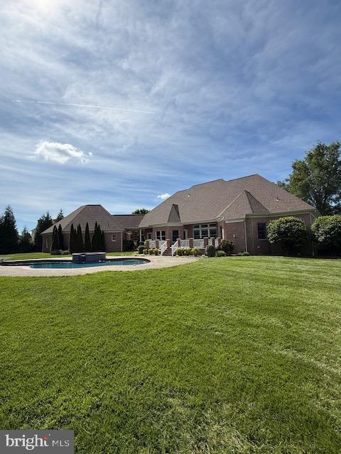 9 Chadwick Dr, Dover, DE 19901 - rear view of house with a lawn