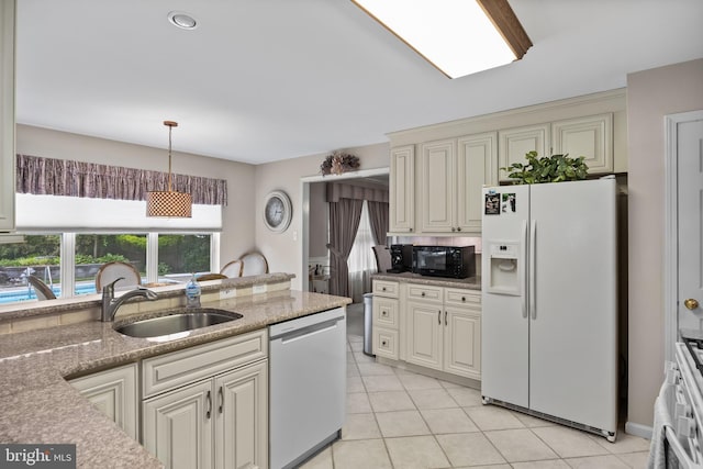 29 Dominion Dr, Marlton, NJ 08053 - kitchen with white fridge with ice dispenser, dishwashing machine, a sink, black microwave, and light tile patterned flooring