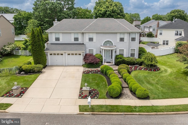 29 Dominion Dr, Marlton, NJ 08053 - view of front of house featuring concrete driveway, a garage, a chimney, stucco siding, and a residential view
