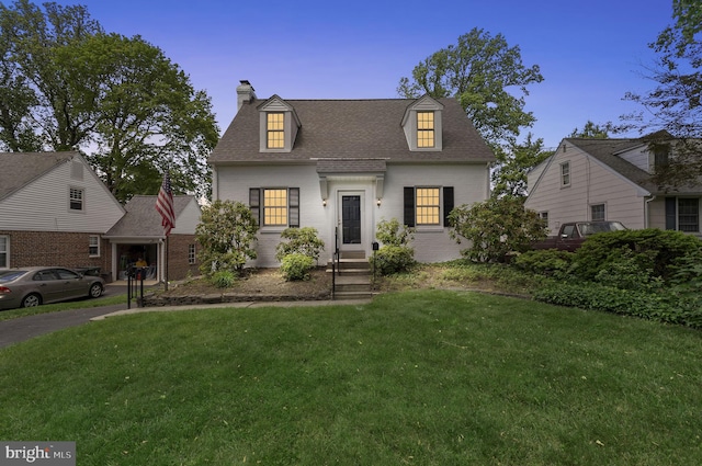 534 Hillcrest Ave, Glenside, PA 19038 - view of front of property featuring brick siding, a chimney, a front yard, and roof with shingles