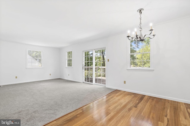 534 Hillcrest Ave, Glenside, PA 19038 - empty room with a chandelier, plenty of natural light, baseboards, and crown molding