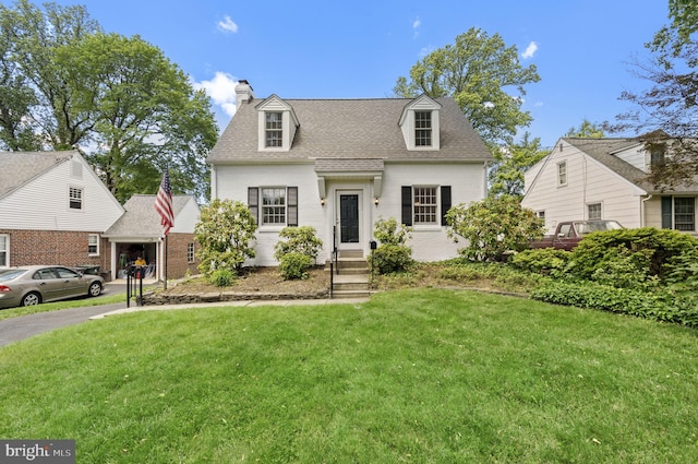 534 Hillcrest Ave, Glenside, PA 19038 - cape cod house with brick siding, a chimney, a front lawn, and roof with shingles