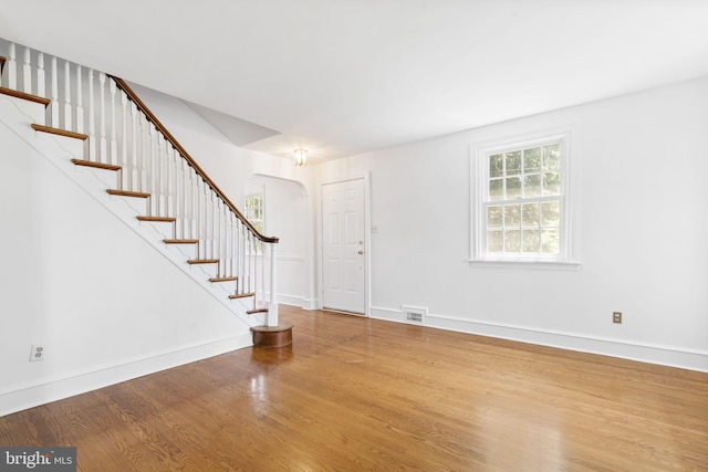 534 Hillcrest Ave, Glenside, PA 19038 - foyer entrance with wood finished floors, arched walkways, stairs, and baseboards