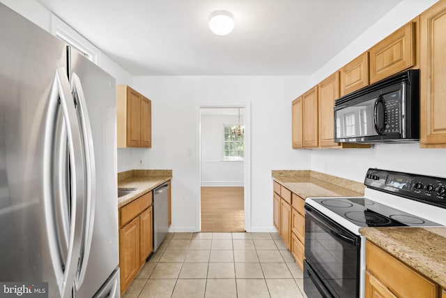 534 Hillcrest Ave, Glenside, PA 19038 - kitchen with black appliances, baseboards, and light tile patterned floors