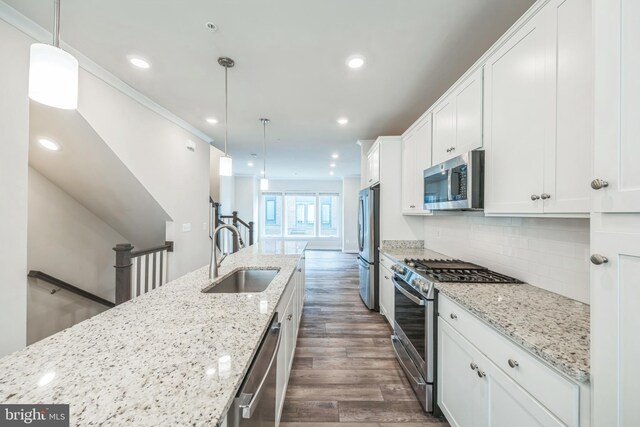 8039 Baxter St, Derwood, MD 20855 - kitchen with appliances with stainless steel finishes, a sink, dark wood-style flooring, white cabinets, and recessed lighting