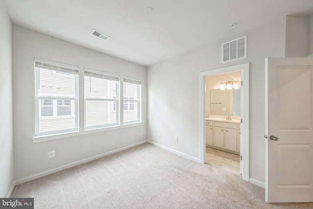 8039 Baxter St, Derwood, MD 20855 - unfurnished bedroom featuring light colored carpet, baseboards, a sink, and ensuite bath