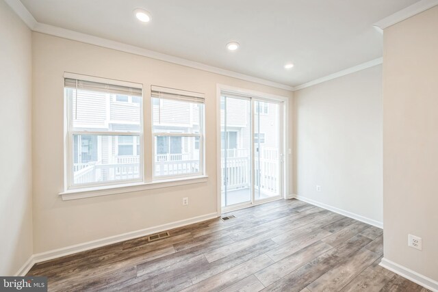 8039 Baxter St, Derwood, MD 20855 - spare room with ornamental molding, healthy amount of natural light, wood finished floors, baseboards, and recessed lighting