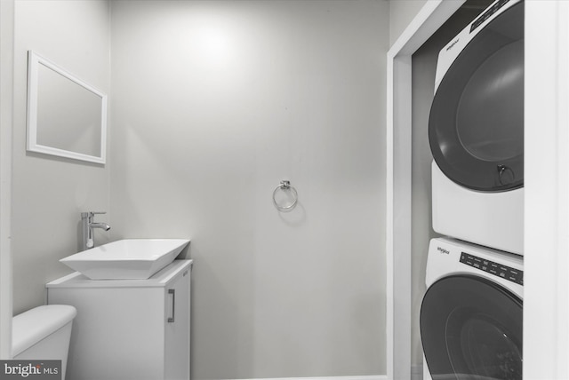 207 Fairfield Ct Unit 207, West Chester, PA 19382 - half bathroom with estacked washer and dryer, toilet, and vanity