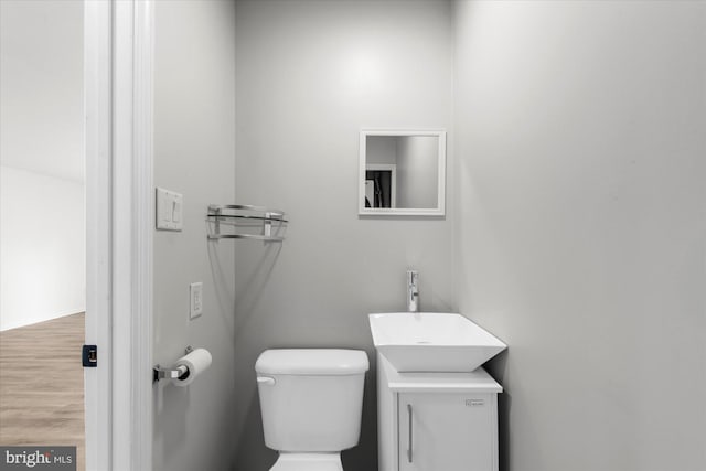 207 Fairfield Ct Unit 207, West Chester, PA 19382 - bathroom featuring vanity, toilet, and wood finished floors