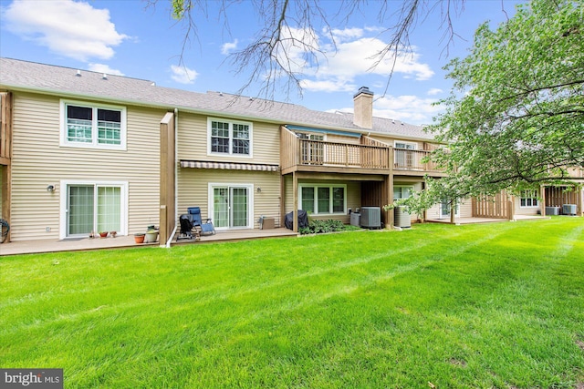 207 Fairfield Ct Unit 207, West Chester, PA 19382 - back of house with a yard, a chimney, a wooden deck, a patio, and central AC unit