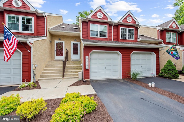 207 Fairfield Ct Unit 207, West Chester, PA 19382 - multi unit property with asphalt driveway, a garage, roof with shingles, and stucco siding