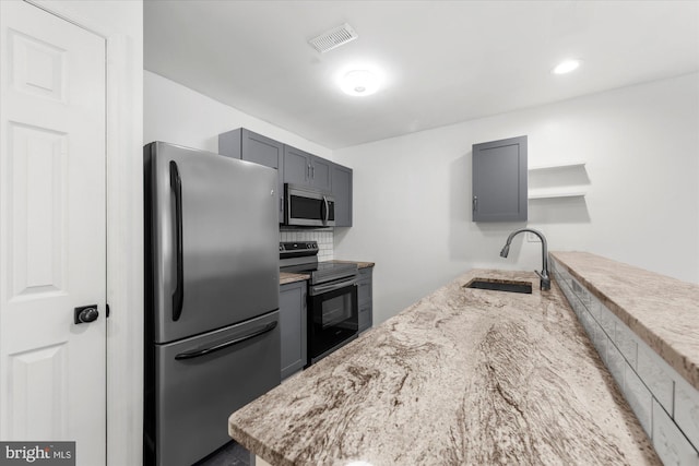 207 Fairfield Ct Unit 207, West Chester, PA 19382 - kitchen featuring appliances with stainless steel finishes, a sink, gray cabinets, and open shelves