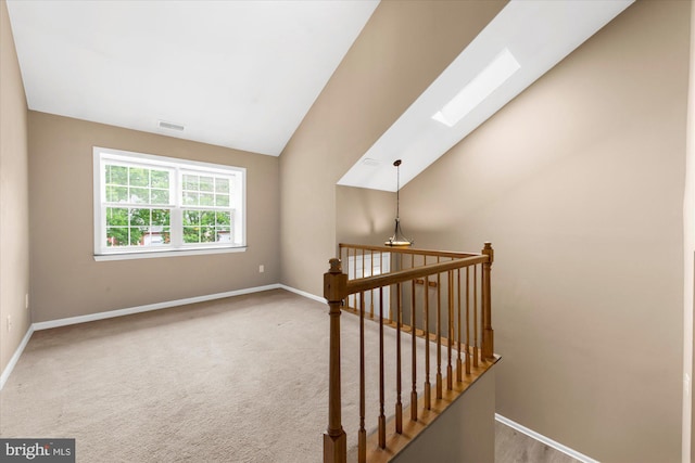 207 Fairfield Ct Unit 207, West Chester, PA 19382 - stairs featuring a skylight, baseboards, vaulted ceiling, and carpet floors