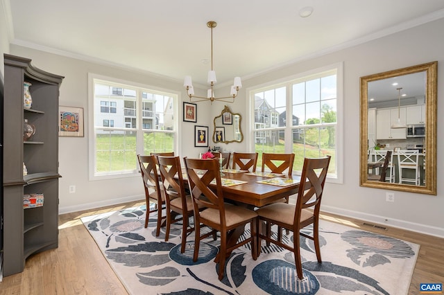 3707 Thicket Run Pl, Charlottesville, VA 22911 - dining space with ornamental molding, light wood-style flooring, and baseboards
