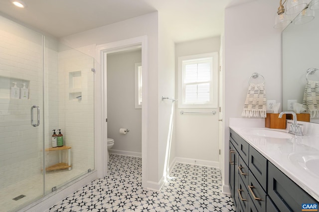 3707 Thicket Run Pl, Charlottesville, VA 22911 - bathroom with a shower stall, toilet, double vanity, baseboards, and tile patterned floors
