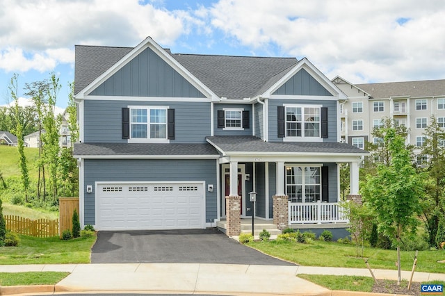 3707 Thicket Run Pl, Charlottesville, VA 22911 - craftsman house featuring covered porch, asphalt driveway, an attached garage, and roof with shingles