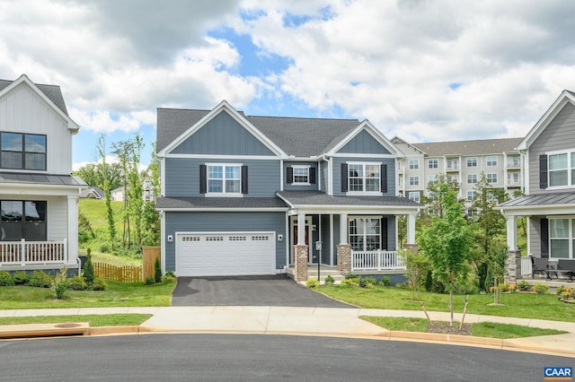 3707 Thicket Run Pl, Charlottesville, VA 22911 - view of front of property with covered porch, board and batten siding, driveway, a garage, and a shingled roof